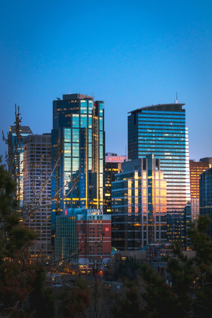 Stunning Cityscape Wallpaper: Modern Glass Buildings & Evening Light