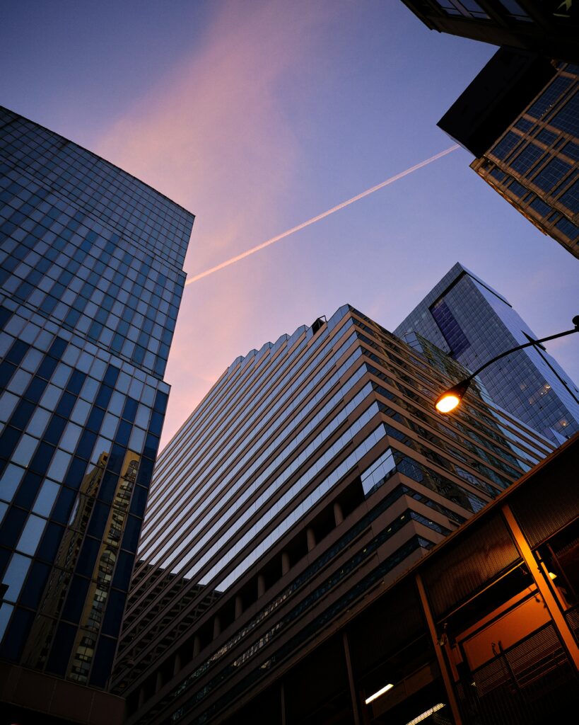 Stunning Cityscape Wallpaper: Towering Buildings & Evening Glow