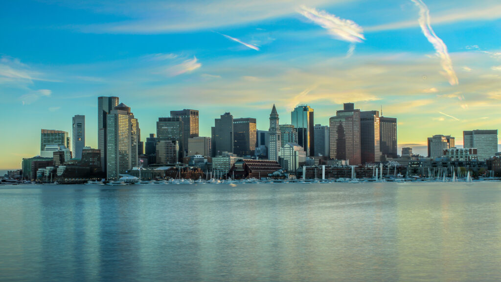 Serene Cityscape Wallpaper: Modern Buildings & Vibrant Sky Reflection
