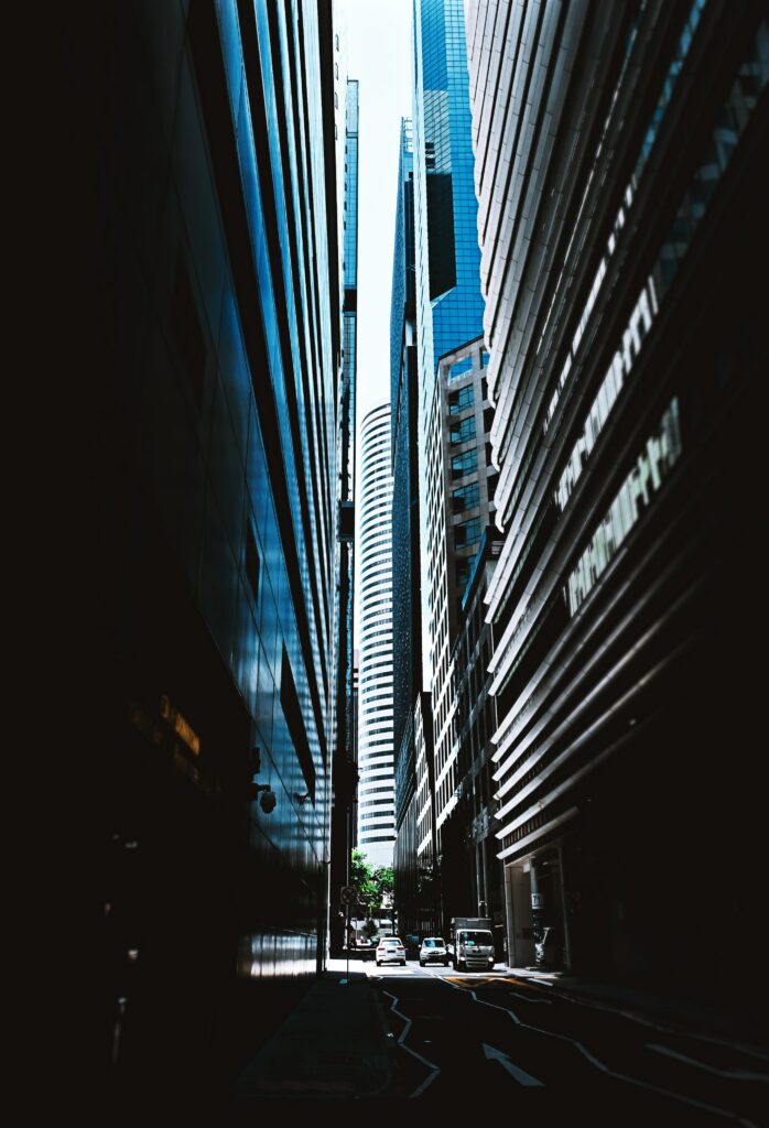 Stunning Cityscape Wallpaper: Modern Buildings & Sunlit Street Scene