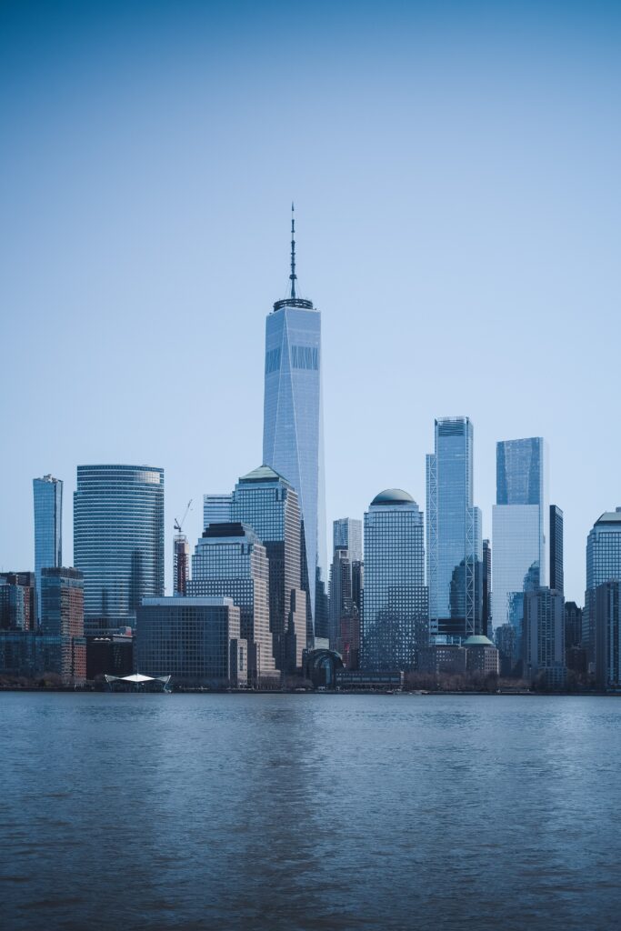 Elegant Cityscape Wallpaper: Modern Skyscrapers & Water Reflections