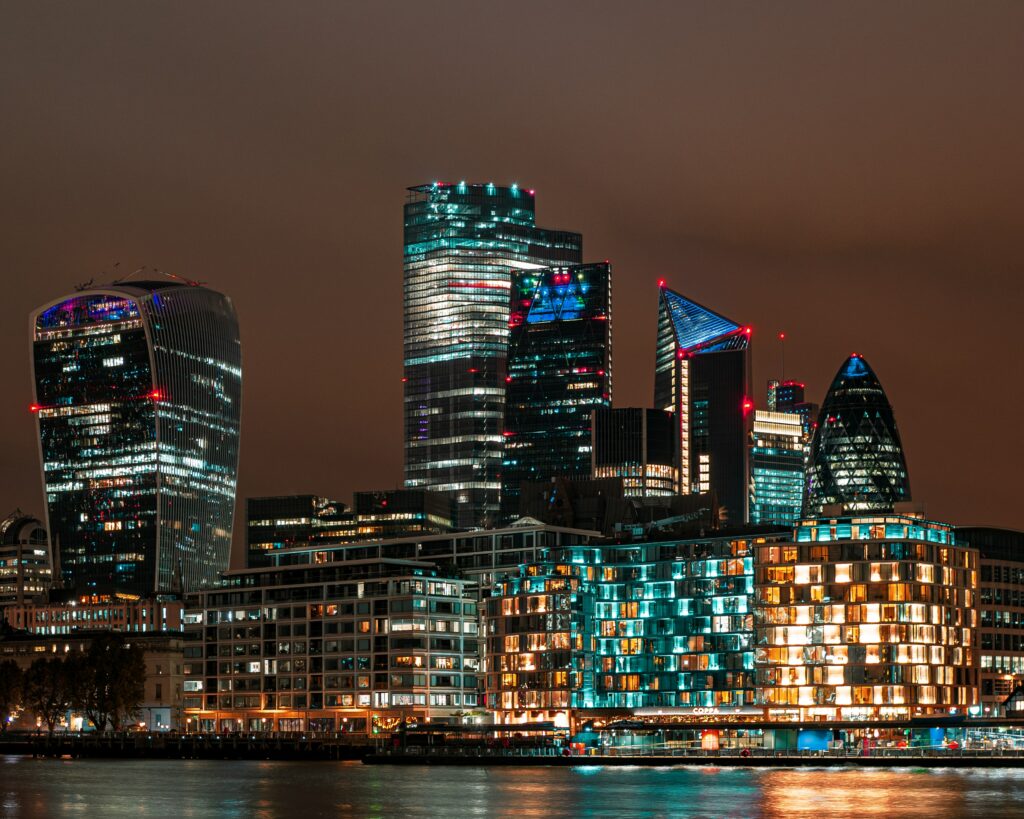 Stunning Night Cityscape Wallpaper: Modern Skyscrapers & Reflections