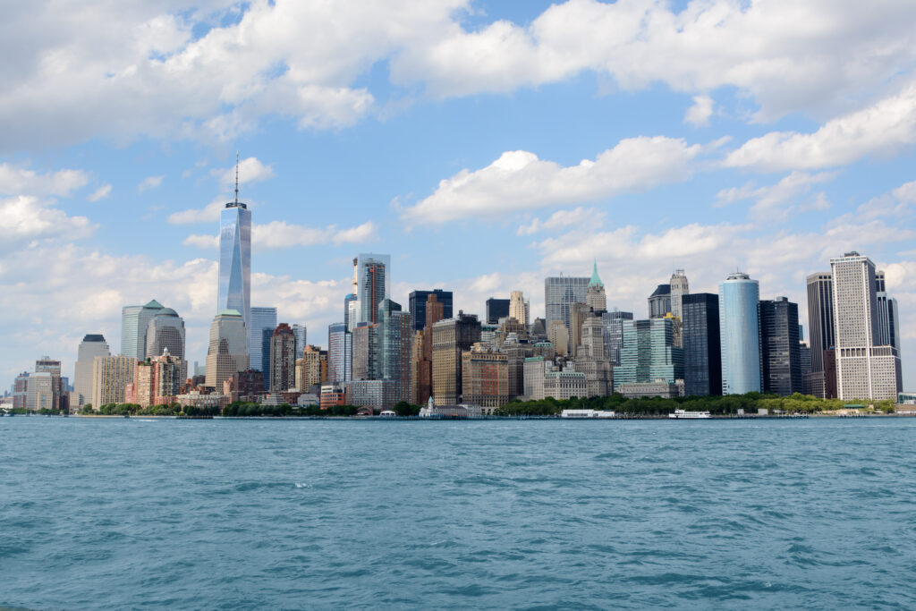 Stunning Cityscape Wallpaper: Skyscrapers & Blue Sea Beauty