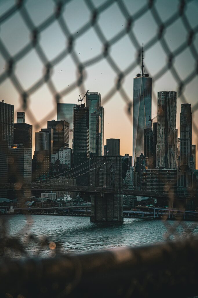 Stunning Cityscape Wallpaper: Skyscrapers & Lattice Fence View