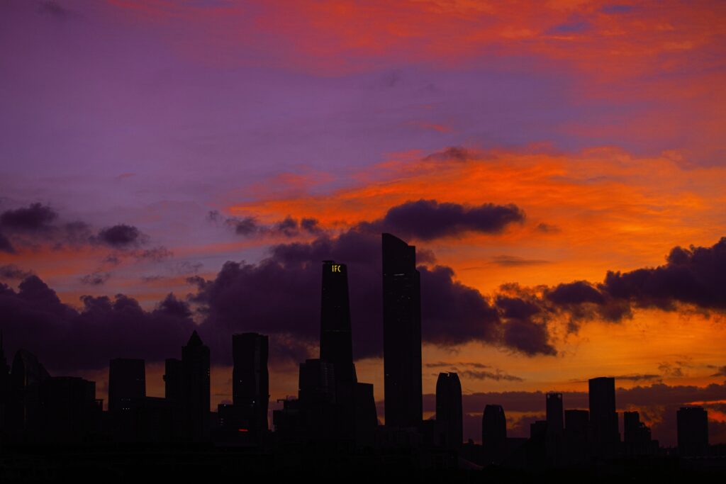 Stunning Cityscape Wallpaper: Skyscrapers at Dramatic Sunset