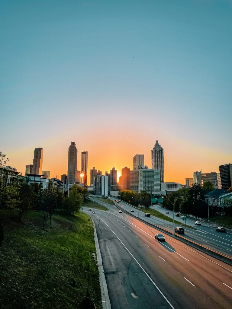 Stunning Cityscape Wallpaper: Sunset Illuminated Urban Scene
