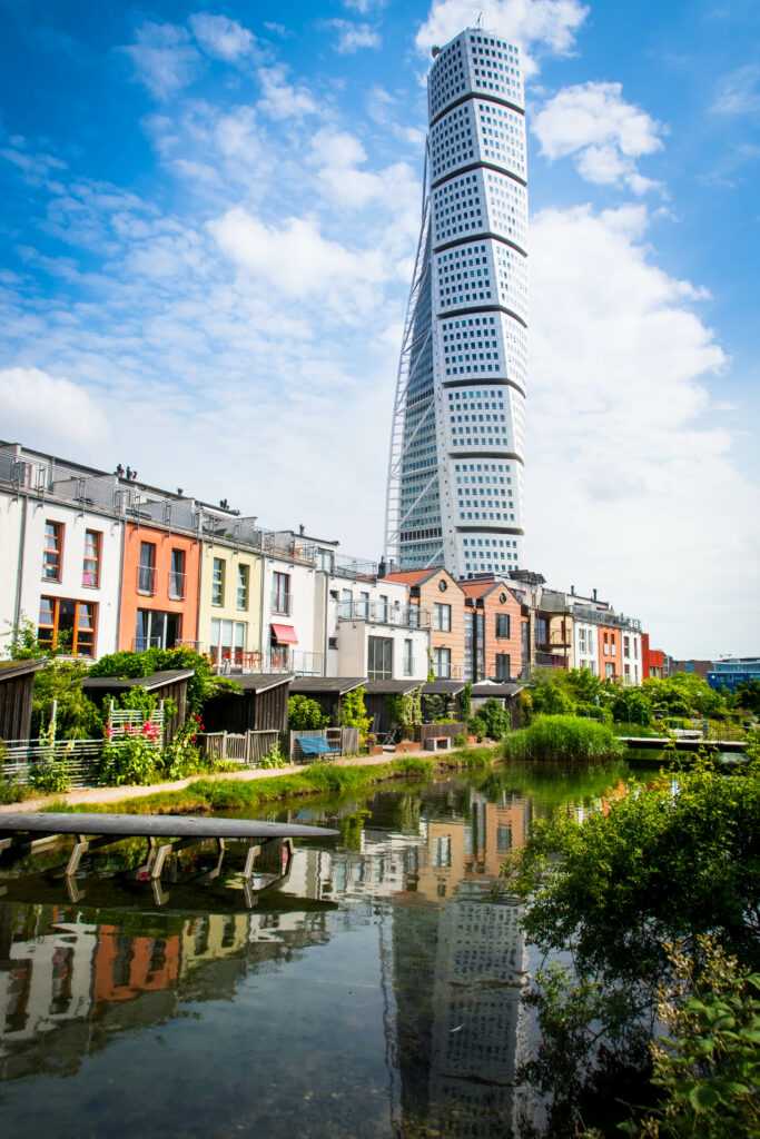 Vibrant Cityscape Wallpaper: Turning Torso & Serene River Reflection