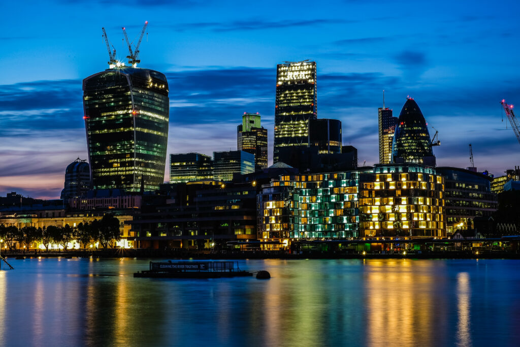 Breathtaking Night Cityscape Wallpaper: Modern Architecture & Reflections