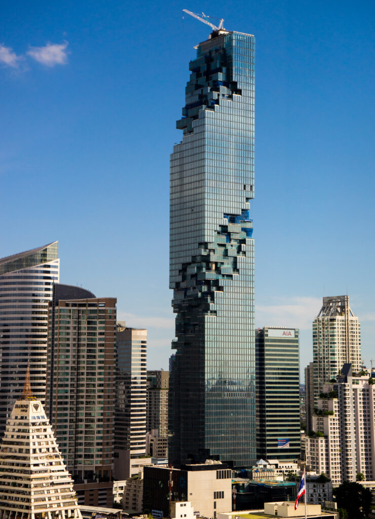 Modern Cityscape Wallpaper with Unique Pixelated Skyscraper Design