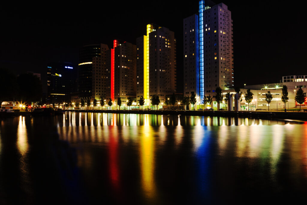 Stunning Night Cityscape: Colorful Lights & Reflections Wallpaper