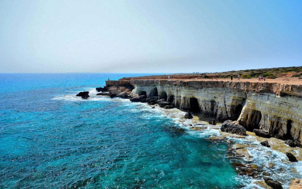 Stunning Cliffside Ocean View Wallpaper for Tranquil Laptop Background