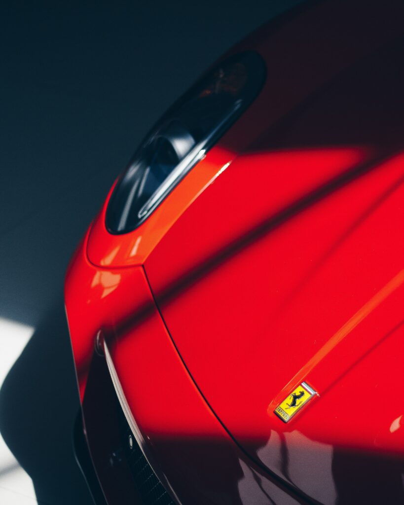 Stunning Red Ferrari Close-Up Wallpaper: Luxury & Performance Design