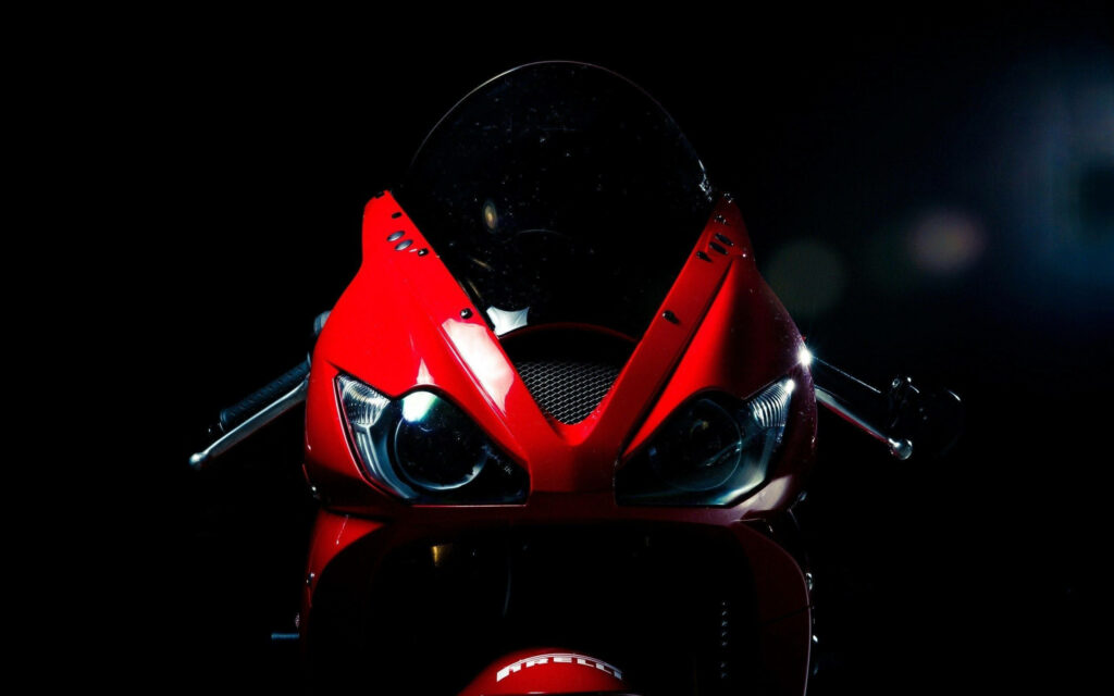 Stunning Red Sports Bike Wallpaper: Close-Up in Dramatic Lighting