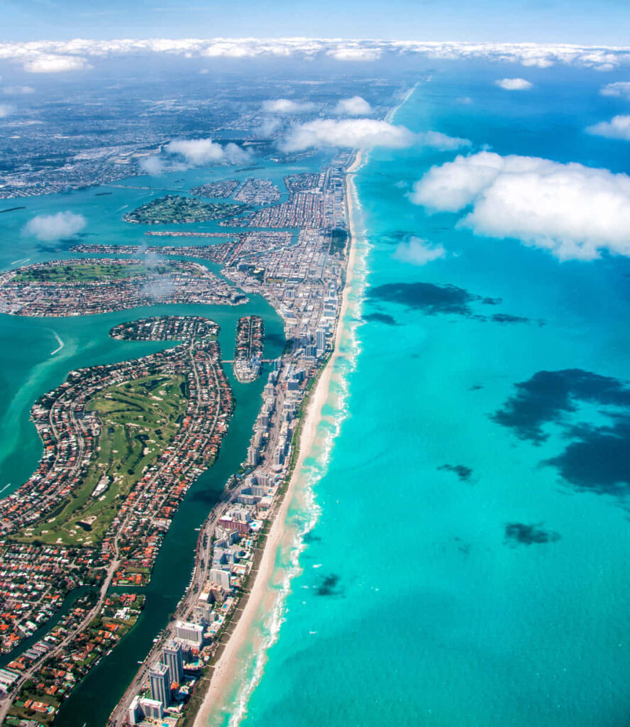 Breathtaking Coastal City Aerial Wallpaper: Turquoise Waters & Beaches