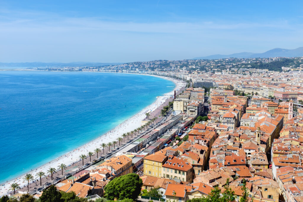 Vibrant Coastal City Aerial Wallpaper with Palm Trees and Beaches