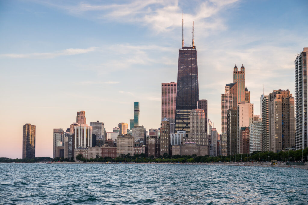 Stunning Coastal Cityscape Wallpaper: Modern Architecture at Dusk