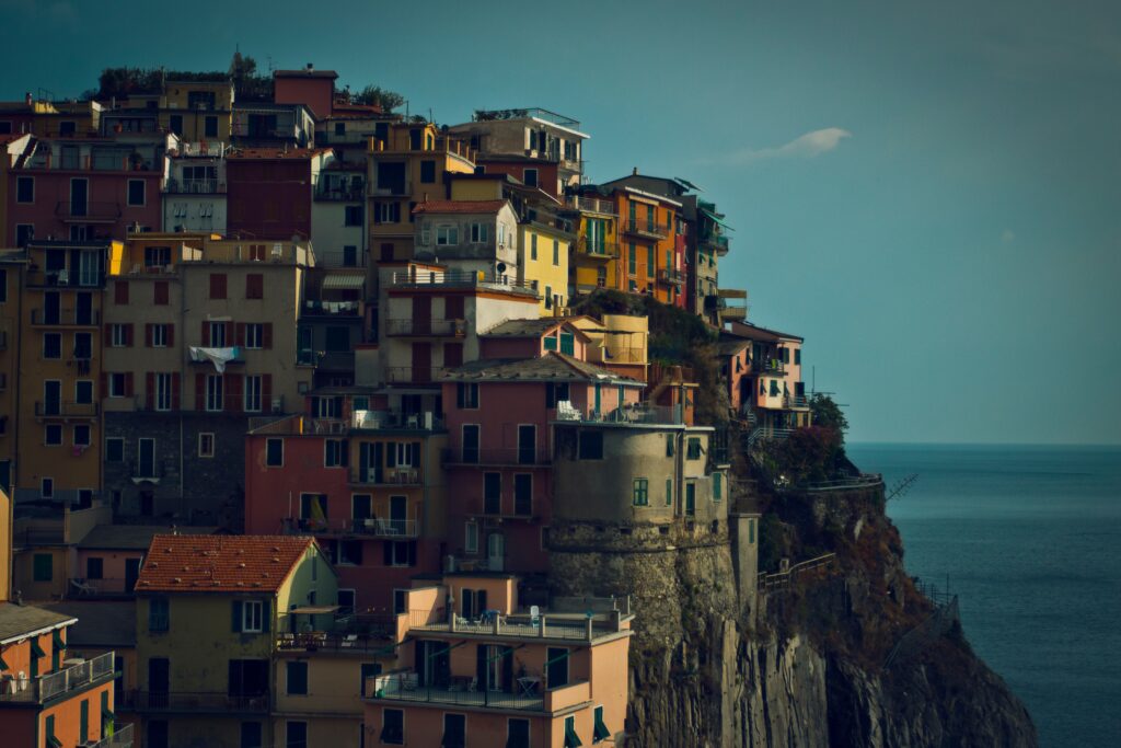 Picturesque Coastal Village Wallpaper - Colorful Houses & Serene Sea