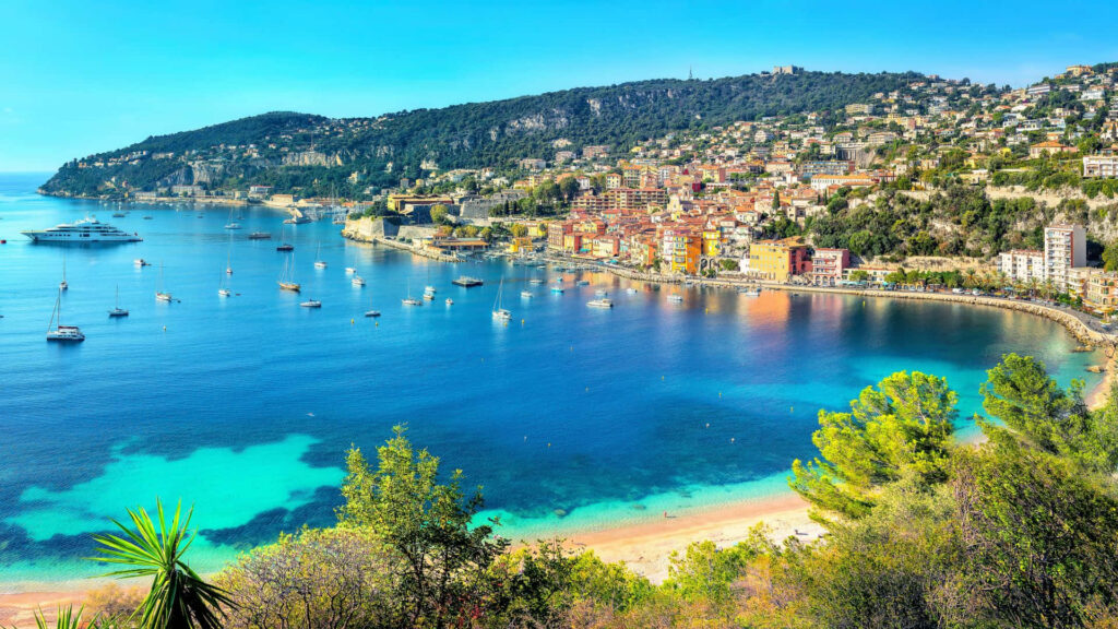 Coastal Village Wallpaper: Colorful Houses by Calm Turquoise Bay
