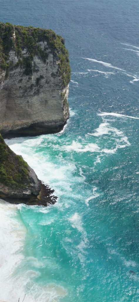Stunning Coastal Wallpaper: Turquoise Waves & Rugged Cliffs Background