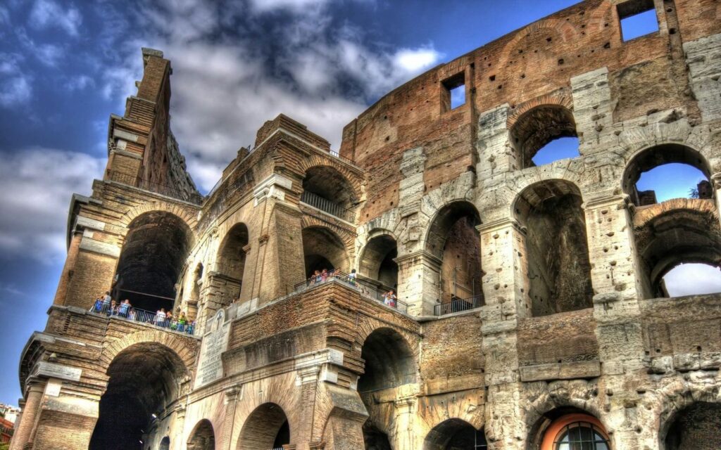 Stunning Colosseum Wallpaper: Ancient Arches Against a Bright Sky