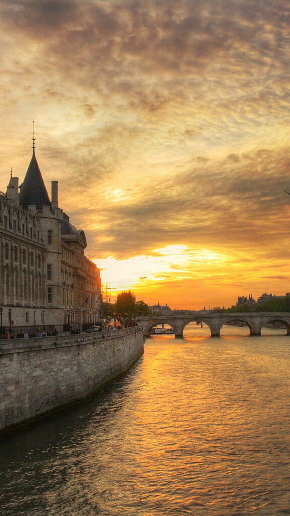 Stunning Sunset Riverside View of Conciergerie - Wallpaper Background