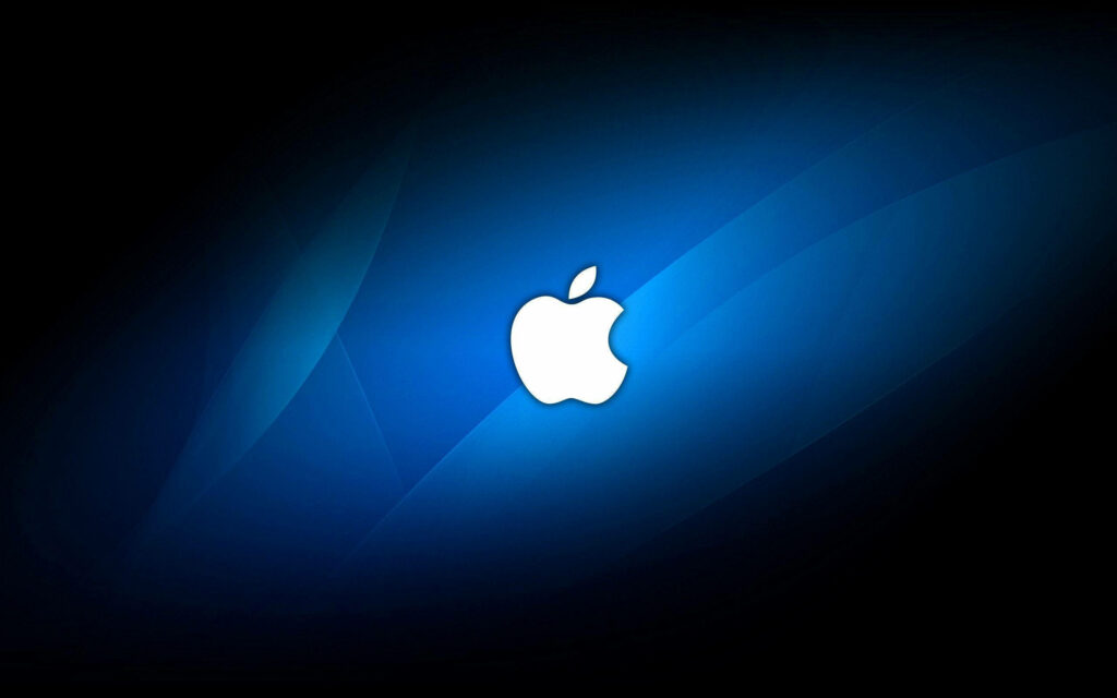 The Bold Contrast of Apple's Iconic Logo Against a Black and Blue Background Wallpaper