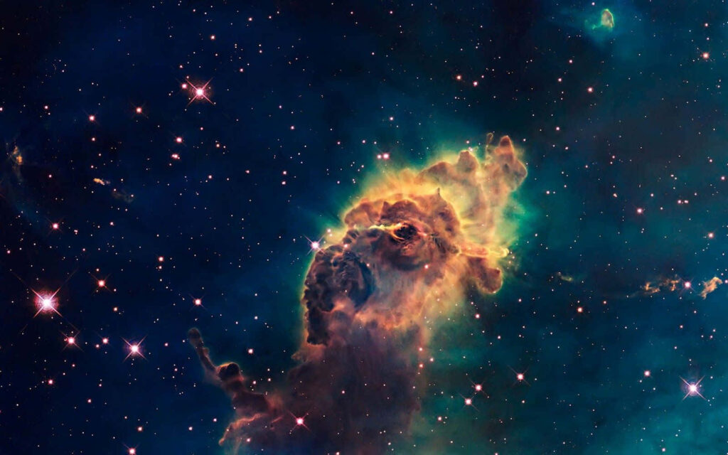 Vibrant cosmic nebula clouds glowing among countless sparkling stars in the universe. Wallpaper