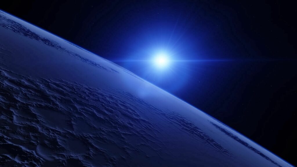 Serene Cosmic Wallpaper: Glowing Star Over Rugged Planet Surface