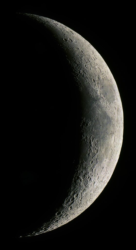 Stunning Crescent Moon Wallpaper: Textured Craters & Dramatic Light