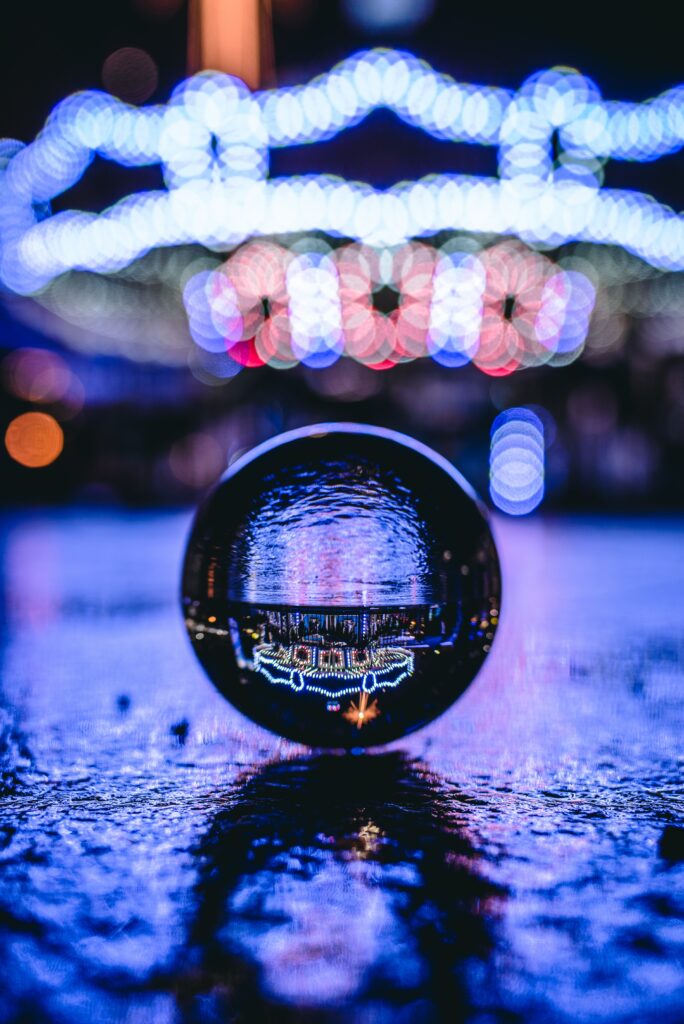 Vibrant Bokeh Reflection in Crystal Ball - Artistic Wallpaper Background