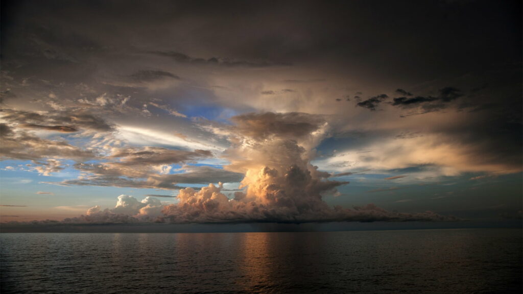 Stunning Cumulonimbus Cloud Wallpaper over Calm Sea Background