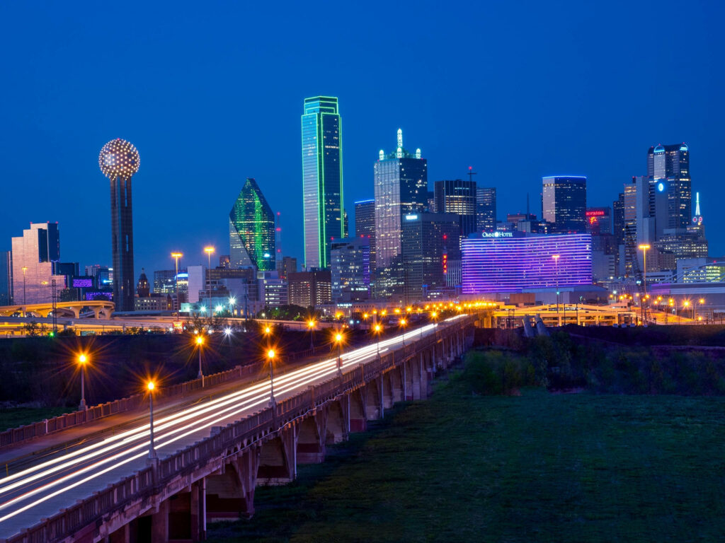 Stunning Dallas Skyline at Night: Illuminated Bridge Wallpaper