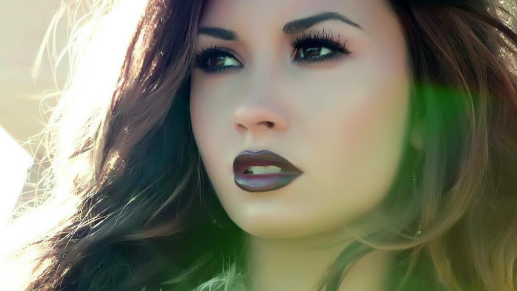 Intense Gaze: Demi Lovato Close-Up Wallpaper with Glowing Light