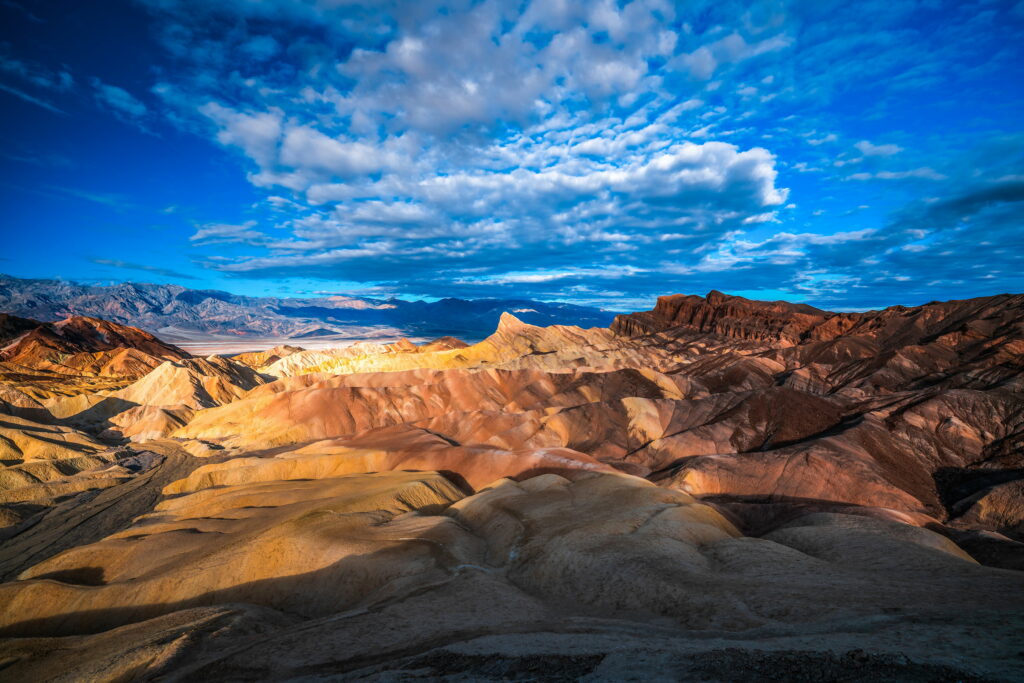 Stunning HD Desert Landscape with Colorful Rocks & Blue Sky Background Wallpaper