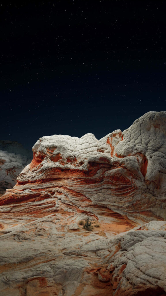 Stunning Desert Rock Formation iPhone Wallpaper Under Starry Sky