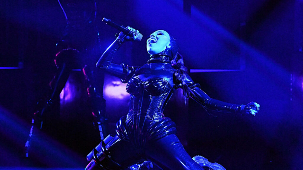Doja Cat's Stunning Stage Performance Wallpaper in Dramatic Blue