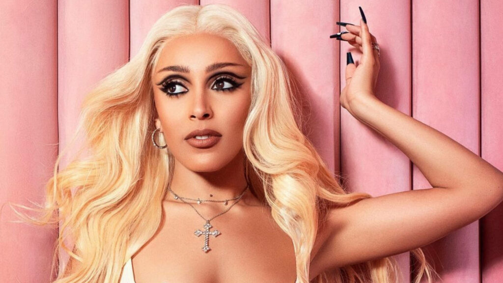 Stunning Doja Cat Wallpaper: Glamorous Blonde on Pink Background