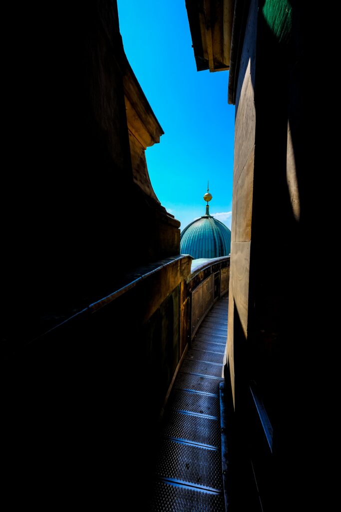 Stunning Dome Roof Pathway Wallpaper: Shadows & Sunlight Contrast