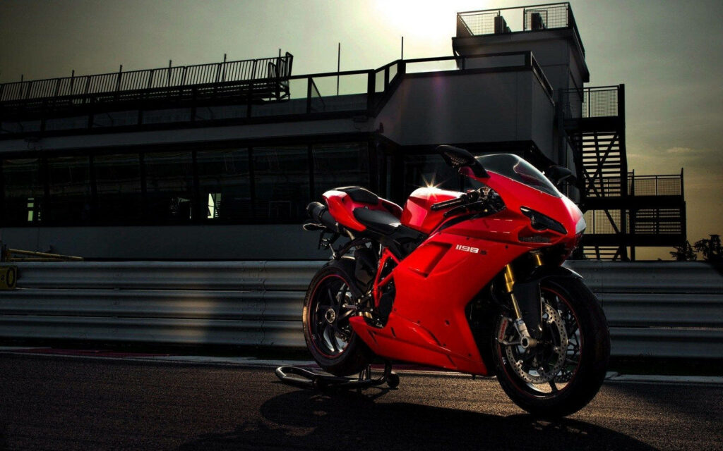 Stunning Ducati 1198s Wallpaper: Sleek Red Bike at Modern Racetrack