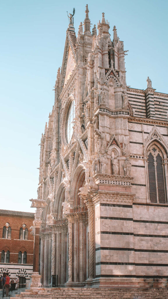 Stunning Side View of Duomo di Siena: Gothic Architecture Wallpaper