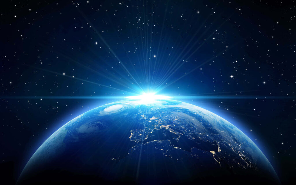 Stunning Earth sunrise from space, glowing against a starry cosmic backdrop - breathtaking wallpaper.