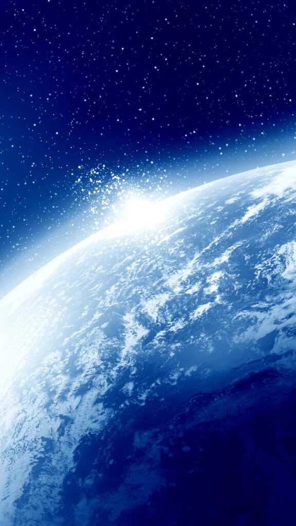 Stunning Earth view from space, curved horizon under sunlight in starry cosmos background. Wallpaper