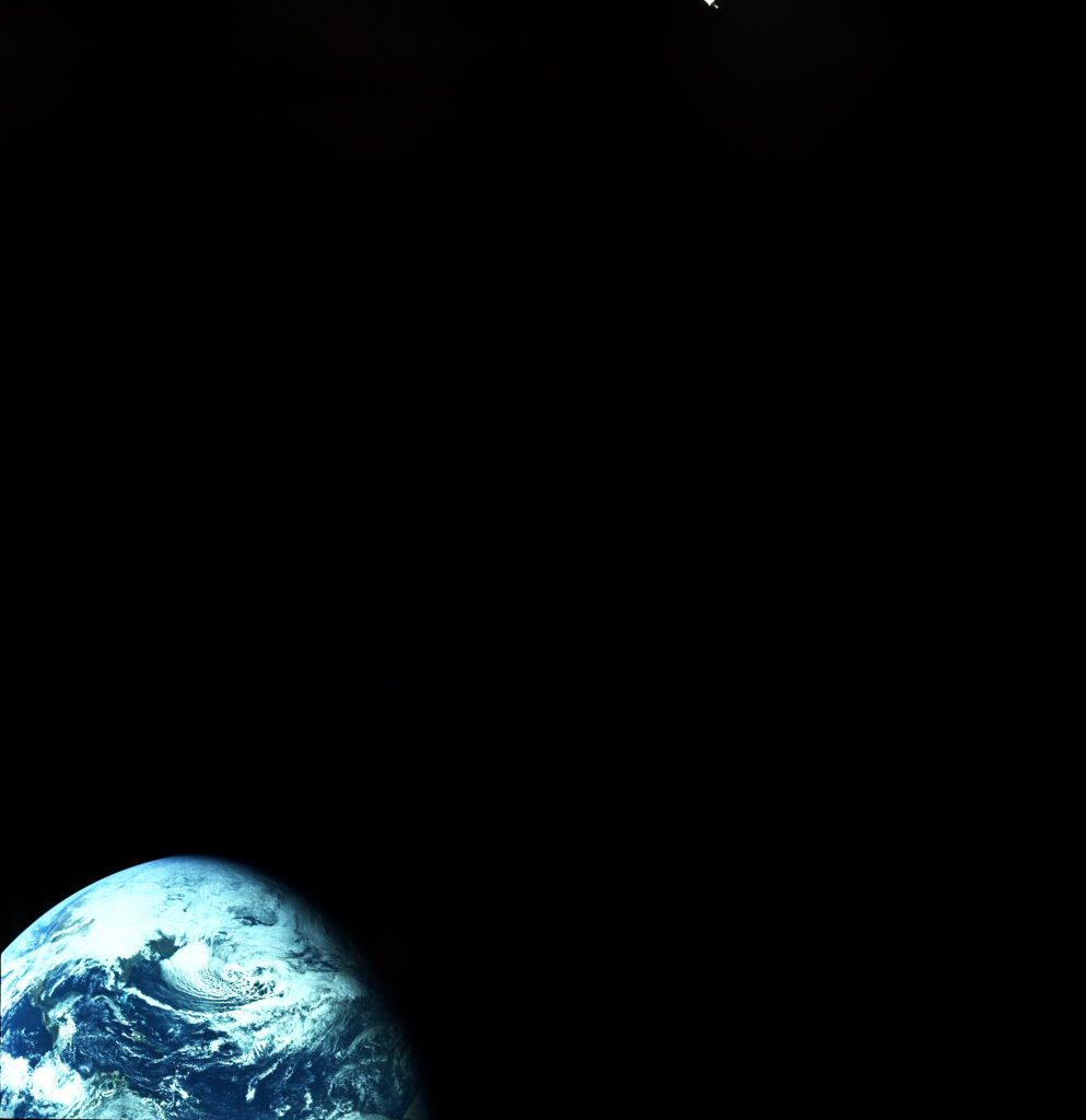 Stunning Earth Wallpaper: Cloudy Planet Amidst Cosmic Space