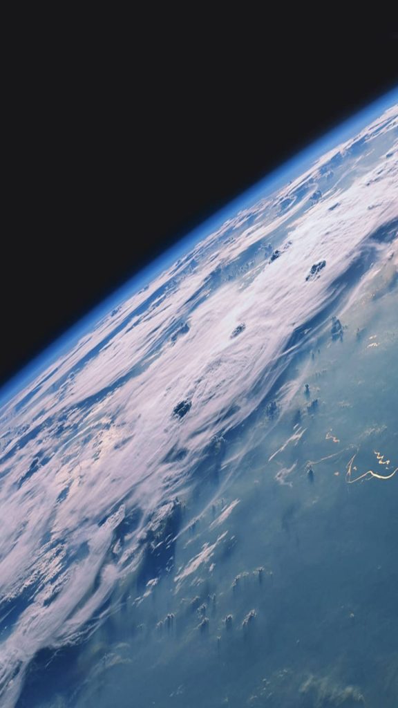 High-resolution Earth from space iOS wallpaper showing planet curvature and blue atmosphere