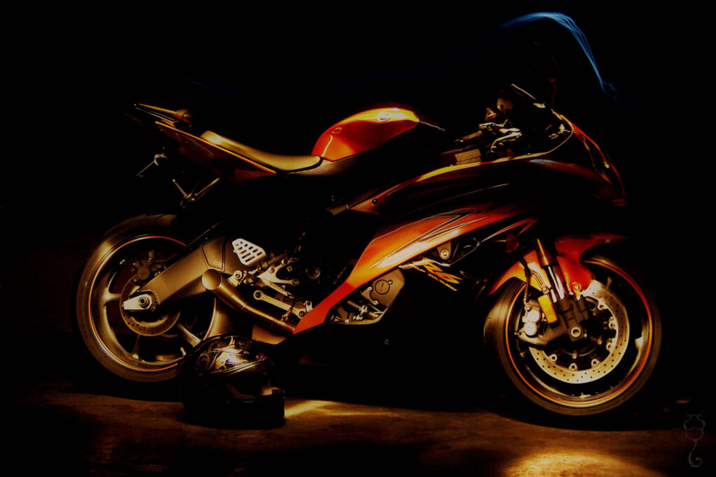 Edgy Red Motorbike Wallpaper: Stunning Dark Background Shot