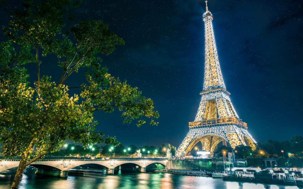 Stunning Eiffel Tower Wallpaper: Night Illumination & Starry Sky
