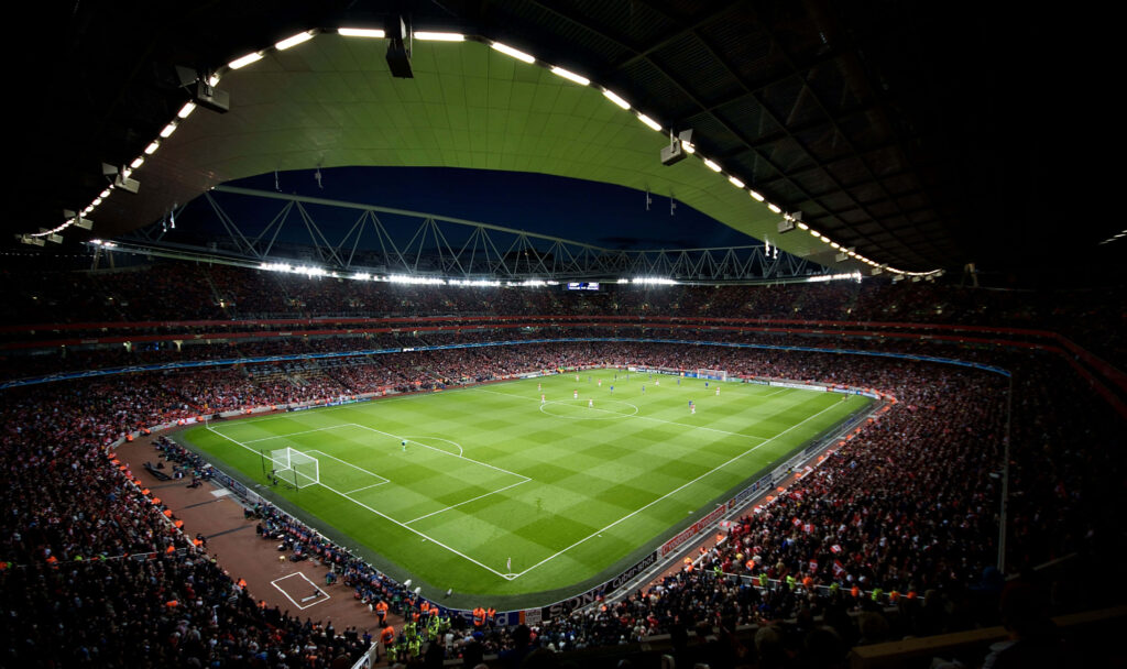 Illuminated Emirates Stadium Night View: Football Wallpaper Background