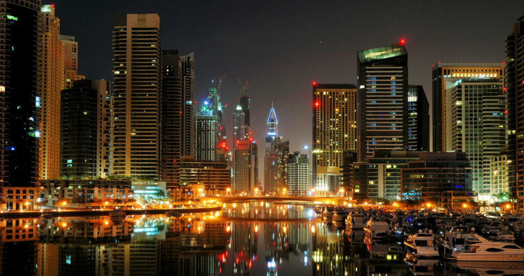 Stunning Evening Cityscape Wallpaper: Vibrant Metropolis Reflections