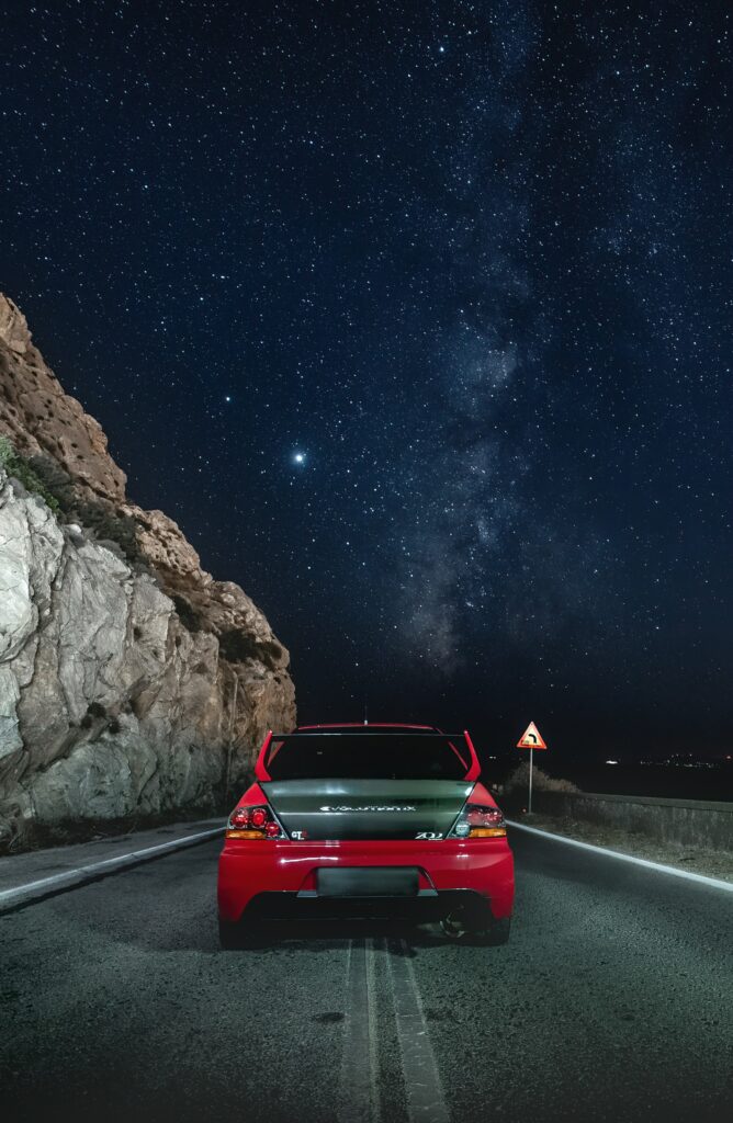 Stunning Evolution GTR Wallpaper: Starry Night & Rocky Landscape