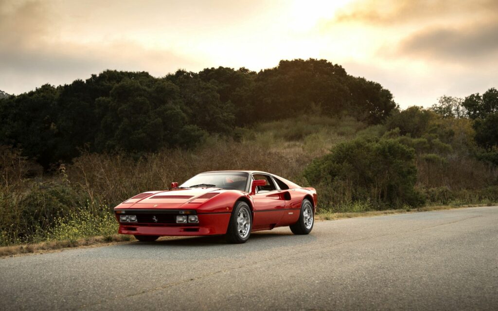 Stunning Ferrari 288 GTO Wallpaper: Classic Red in Serene Nature